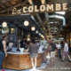 Interior of La Colombe Coffee near Dwell 2nd Street with people ordering at the counter.