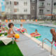 Dwell 2nd Street Residents Swimming in Pool